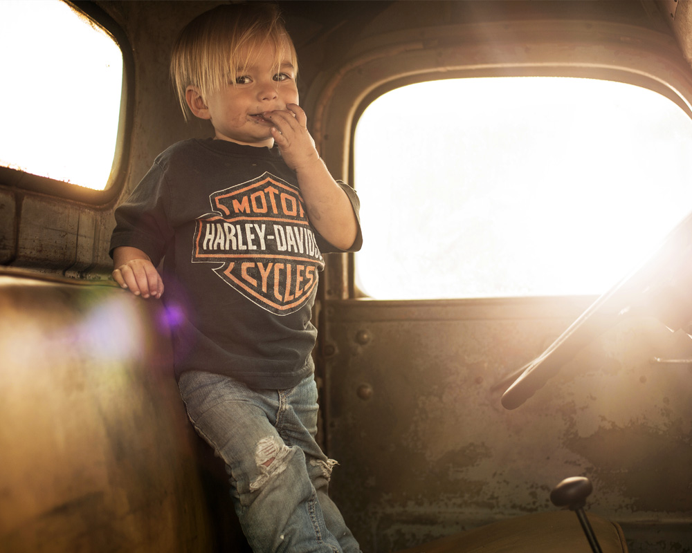 Young boy in old truck