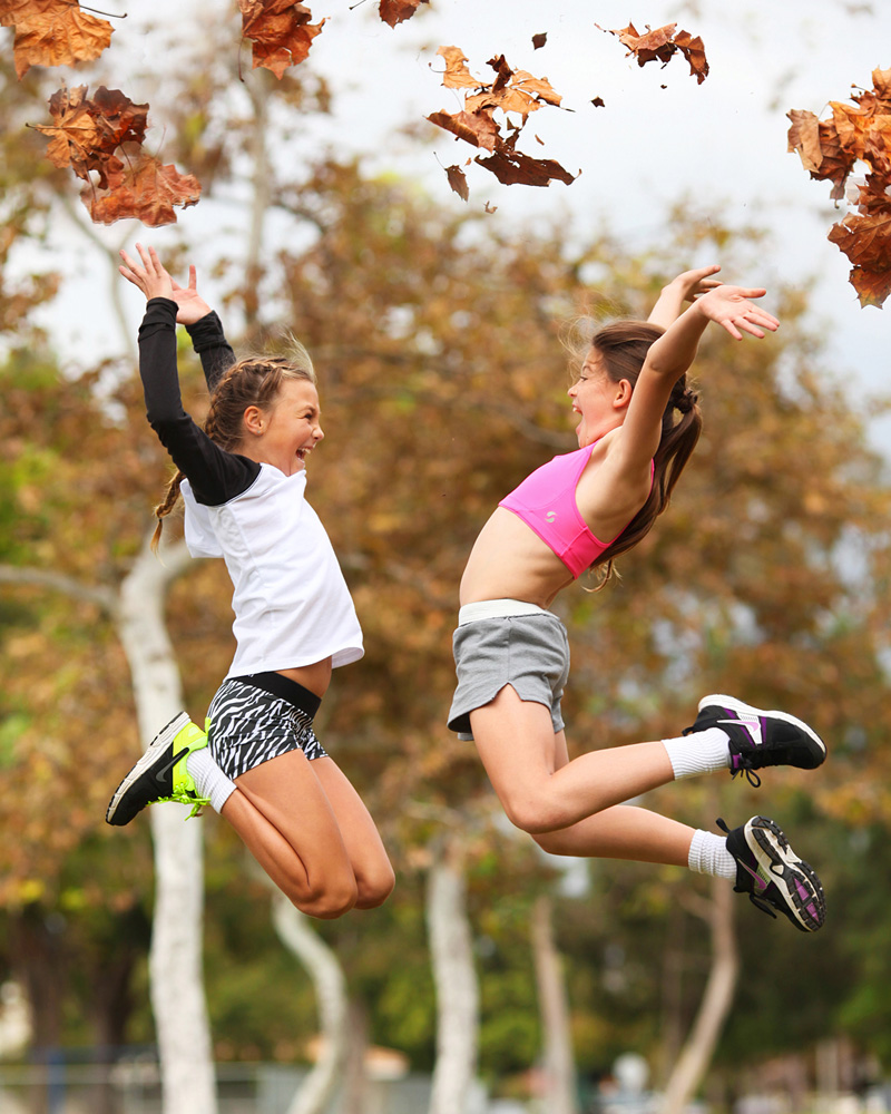 Two girls jumping