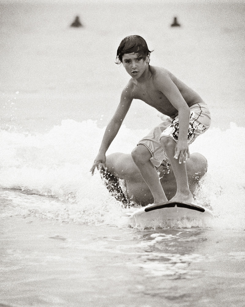Boy learning to surf