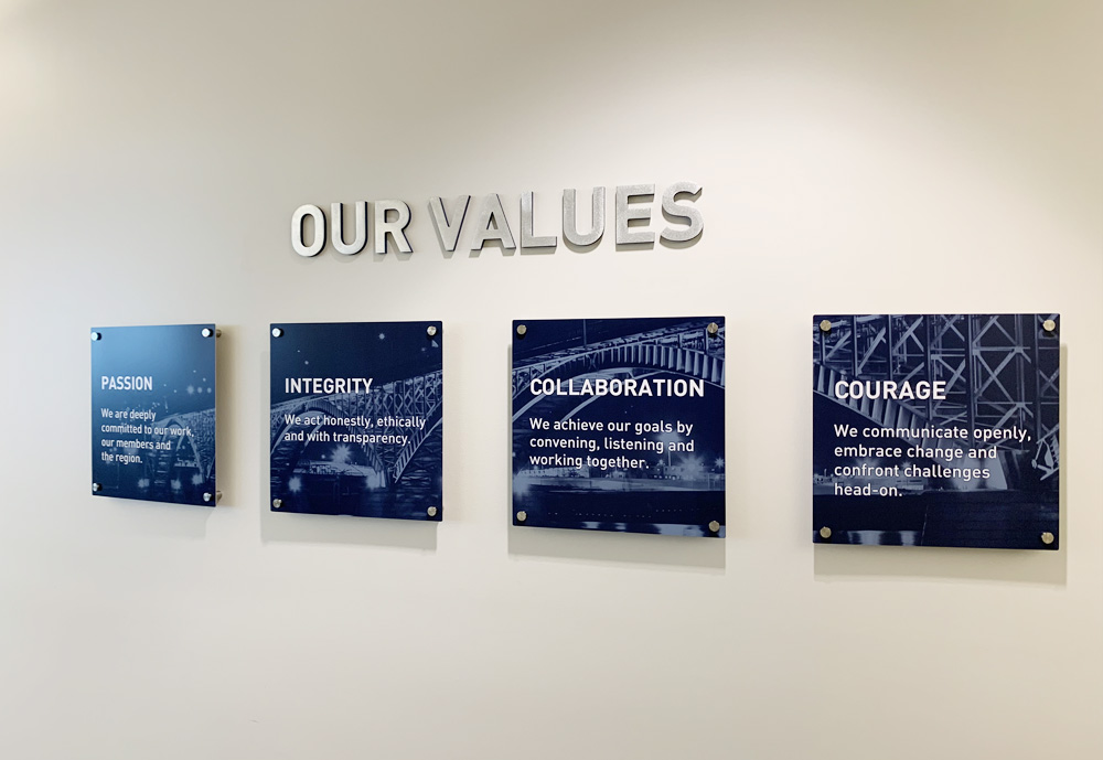 Aluminum prints with Buffalo Niagara's Values mounted on 3D posts. Machined aluminum was used to create the Values heading.