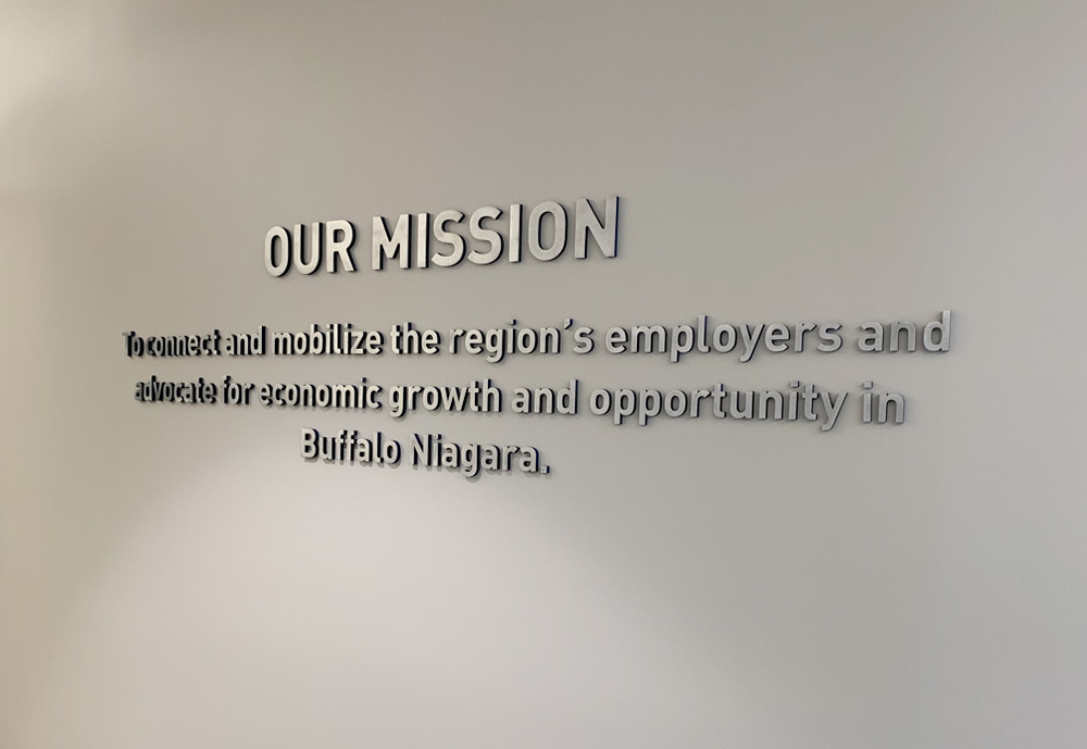 This wall displays 3D machined aluminum letters with the sides painted the corporate blue of the Buffalo Niagara Partnership.