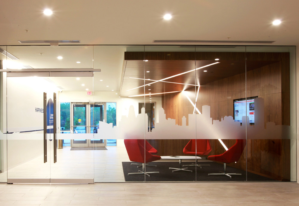 The vinyl graphics on the glass walls of the lobby depict the Buffalo skyline and Niagara River.